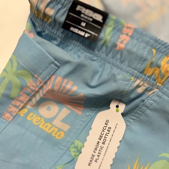 RSQ Men's Baja Swim Trunks in a light blue with a palm tree, rose, and sun print - Picture 3 of 5